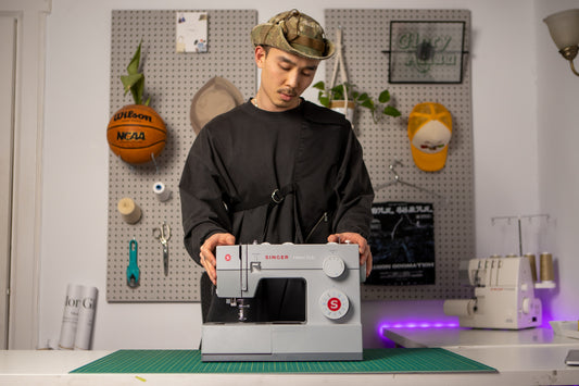 Male with Sewing Machine
