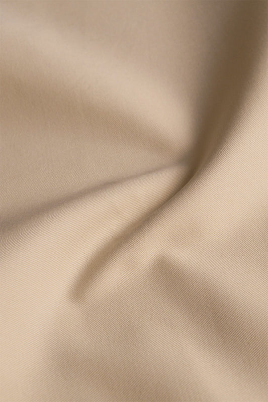 Poly cotton blend fabric in almond beige color - a durable and versatile choice for sewing kits and crafting