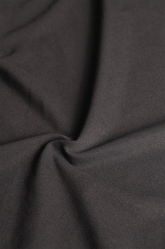 French terry fabric in true black, ideal for crafting comfortable loungewear and athleisure