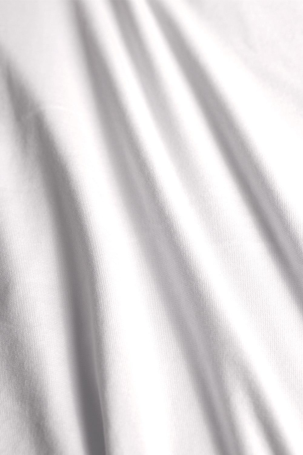 Versatile rib knit textile in snow white, ideal for crafting fitted garments and accessories.
