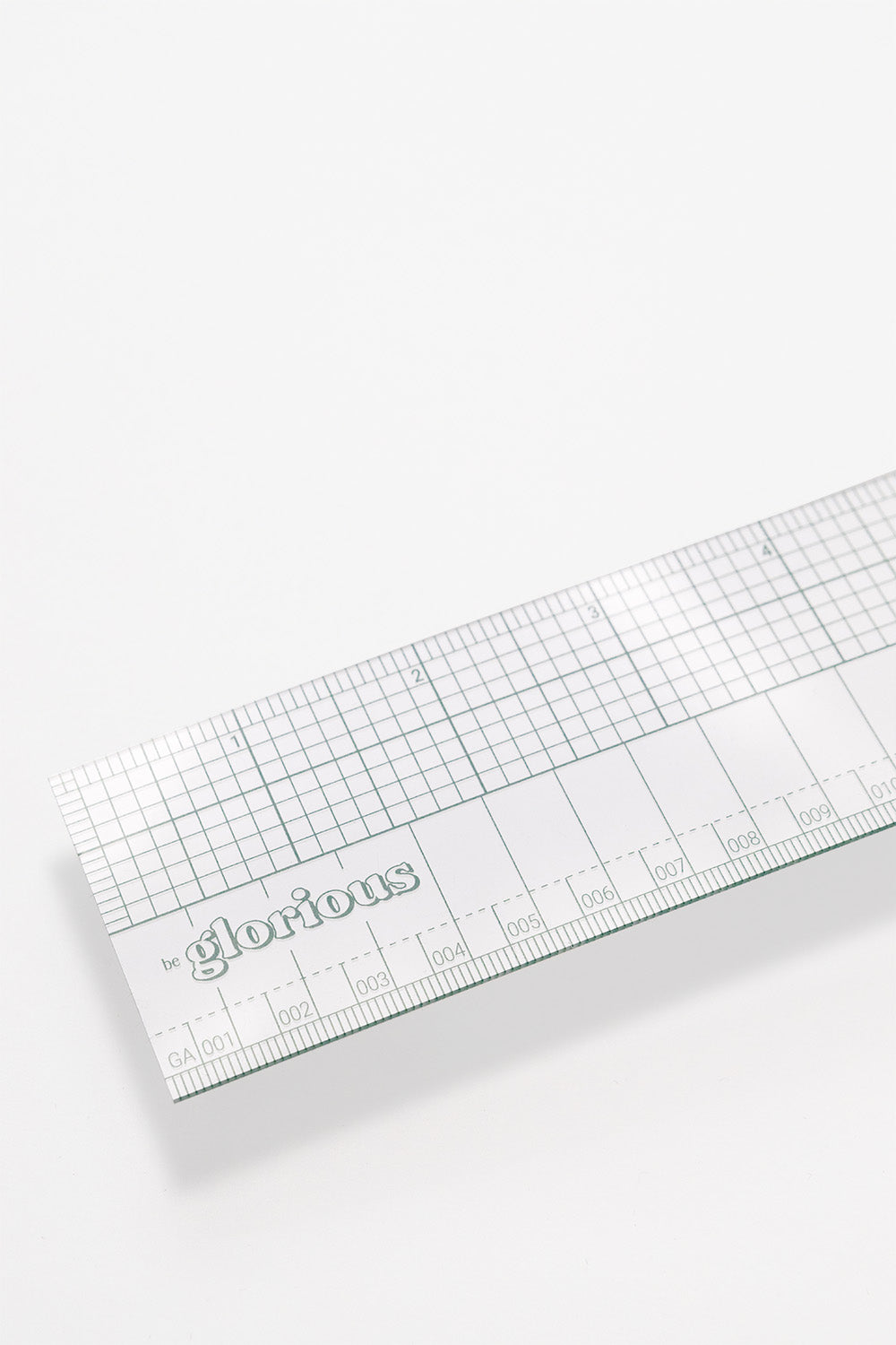 18" transparent ruler with imperial and metric unit markings in a fern green color.